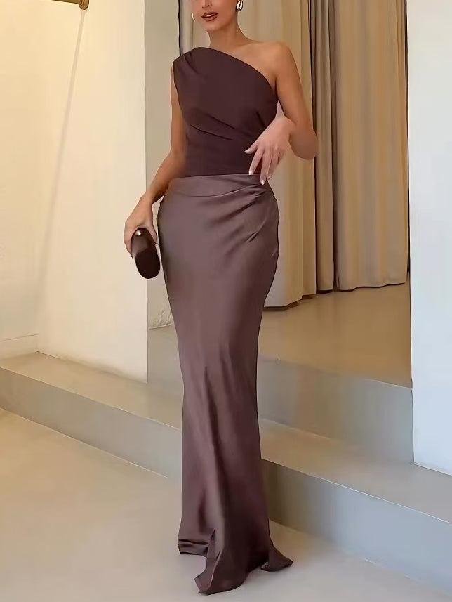 Sophisticated brown asymmetric pleated maxi dress for wedding guests, an elegant formal wear option.