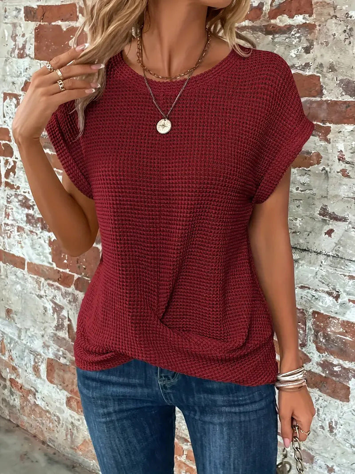 Textured waffle knit short sleeve top for women, offering a cozy, casual, and stylish look.