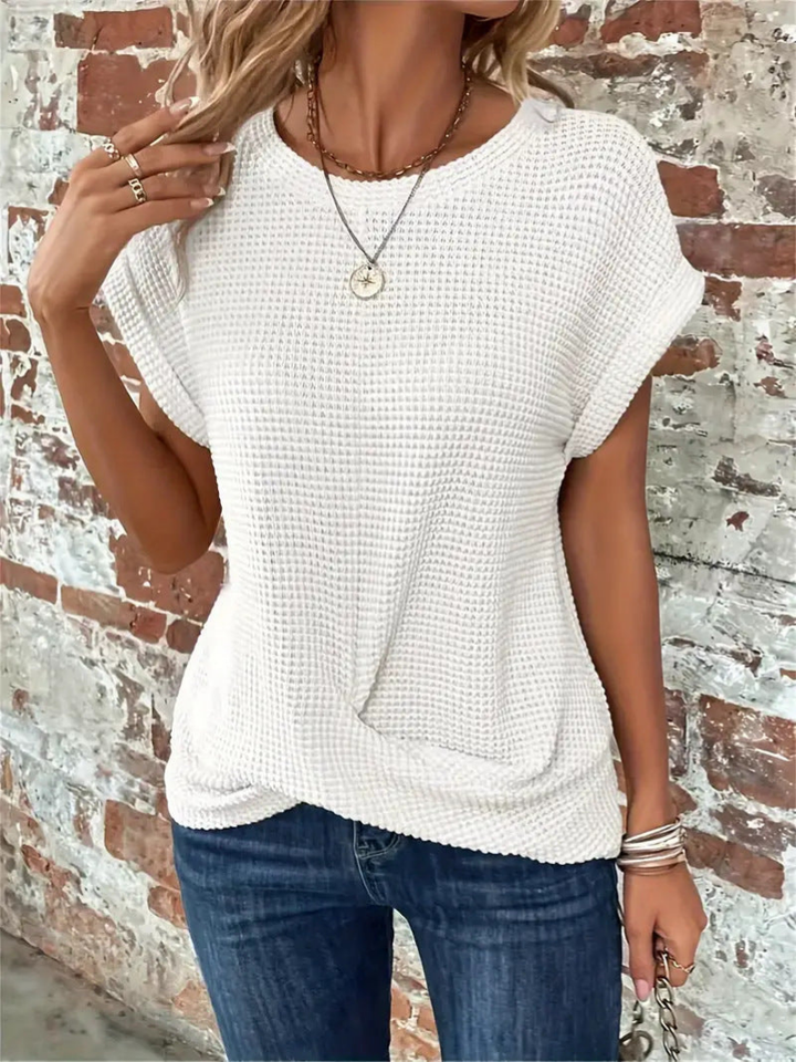 Stylish women's waffle knit short sleeve top, featuring a relaxed fit & round neck for versatile wear.