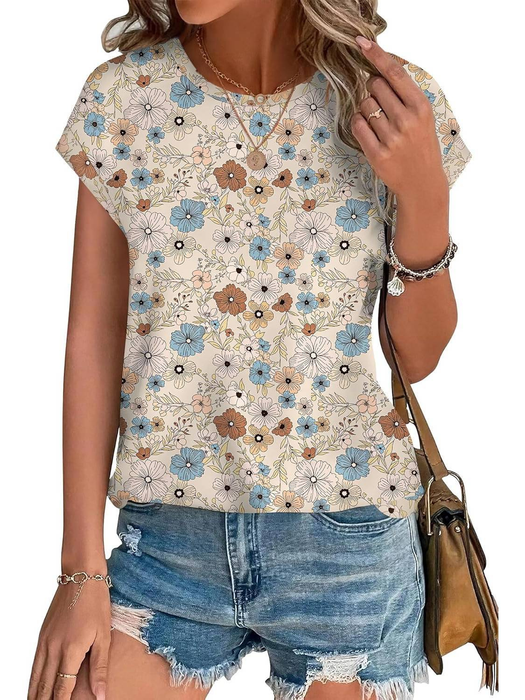 Women's fashion top, cap sleeve, with an eye-catching botanical leaf print.