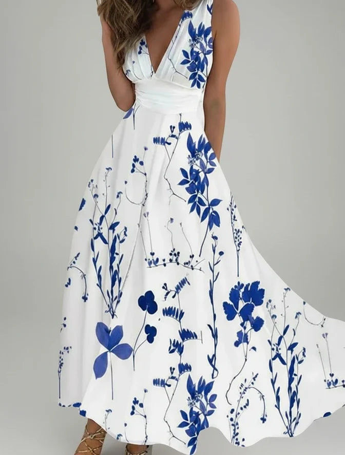 Sleeveless A-line midi dress for women with a delicate floral print & V-neck, ideal for spring casual wear.
