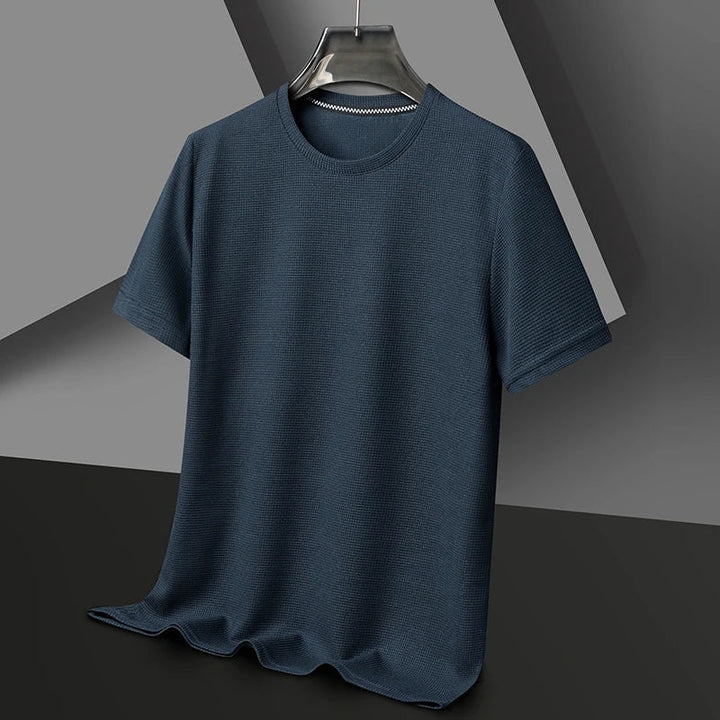 Model wearing a men's versatile waffle knit t-shirt, showcasing casual style and comfort.