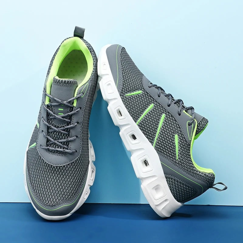 Breathable gray unisex running shoes, providing ultimate comfort & supportive cushioning for runners and walkers.