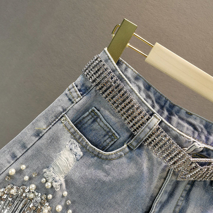 Close-up of a women's dazzling rhinestone belt with shimmering crystals. Adjustable, stylish party accessory.