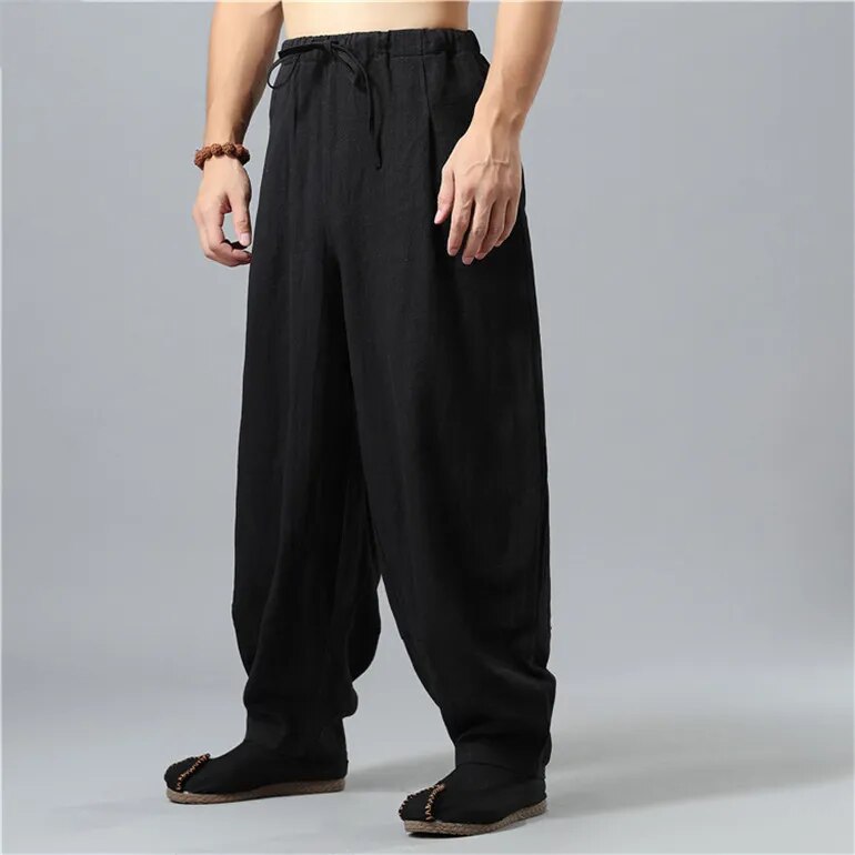 Close-up of drawstring waist on unisex Kodama relaxed baggy pants, offering comfortable, adjustable loose fit.