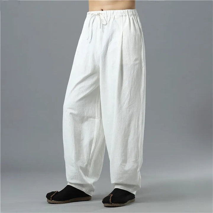 Person walking in unisex Kodama relaxed baggy pants, loose & comfortable fit, perfect for everyday casual movement.