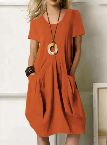 Women's casual midi dress with gathered details, short sleeves, and pockets, perfect for summer everyday wear.