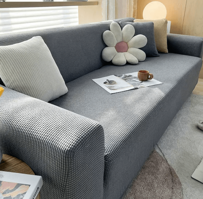 Non-slip sectional couch cover with stylish jacquard design. A washable furniture protector enhancing living room decor.