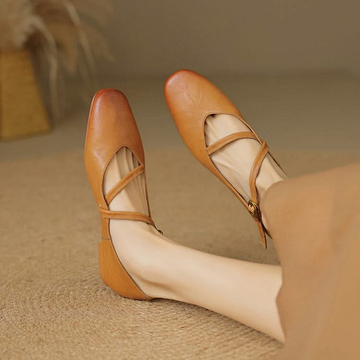 Brown Aria women's comfort flats with adjustable strap for all-day support.