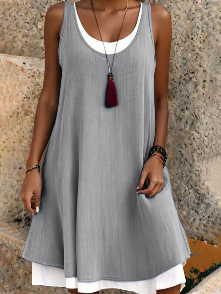 Comfortable two-layer A-line dress for women, featuring a scoop neck and sleeveless design for summer.