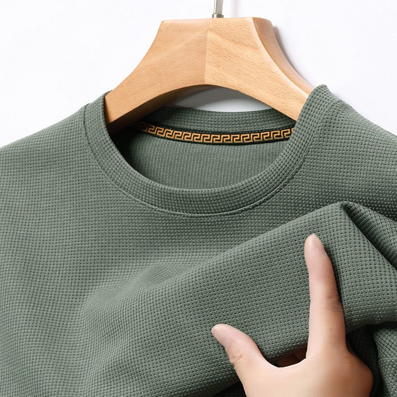 Folded men's premium waffle knit t-shirt, ready for versatile everyday style and comfort.