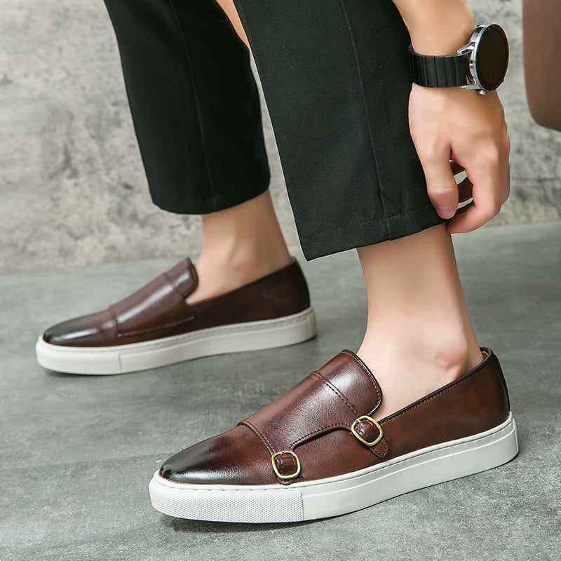 Stylish brown leather monk strap loafers for men, ideal for business casual or formal occasions.