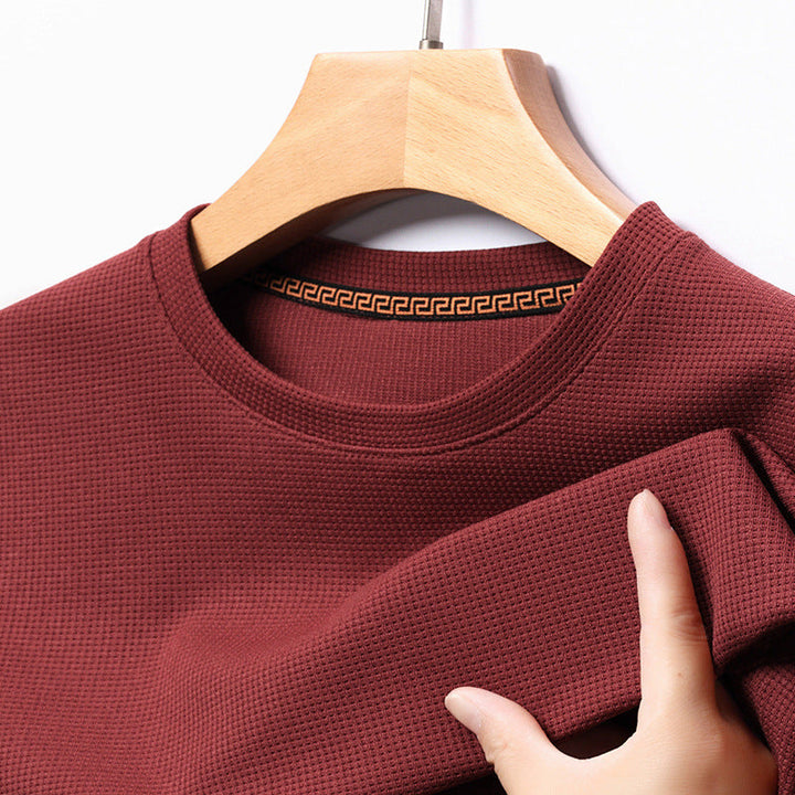 Side view of a man wearing a stylish waffle knit t-shirt, perfect for casual everyday fashion.
