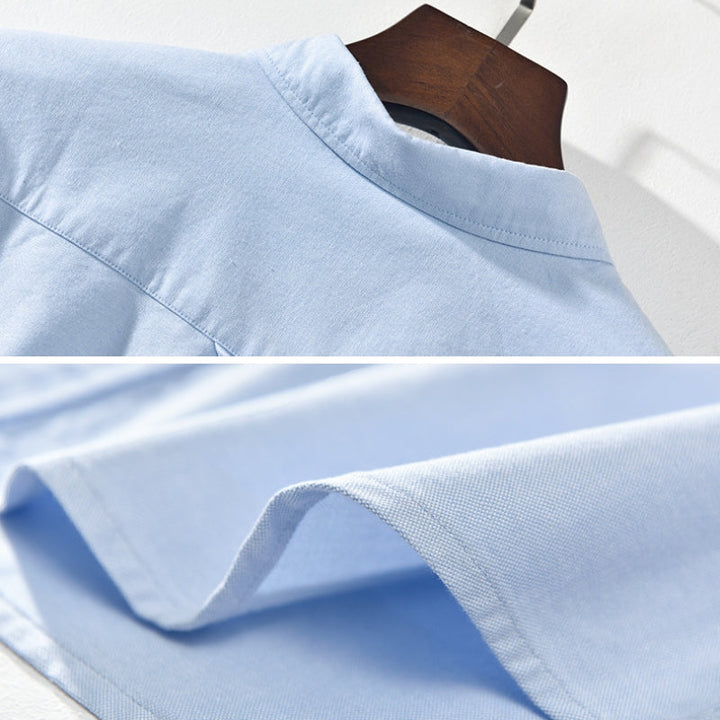 Close-up: Men's classic button-up collared shirt. Soft fabric texture for comfortable, stylish everyday men's wear.