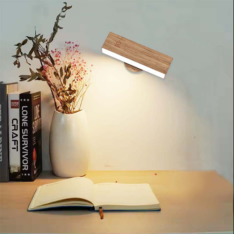 Adjustable modern wood wall light, rechargeable LED sconce, remote-controlled for ambient brown glow.