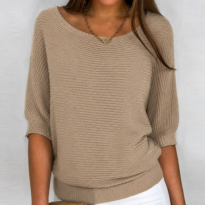 Cozy knit women's 3/4 sleeve sweater. Relaxed fit blouse for comfortable everyday style and versatile layering.