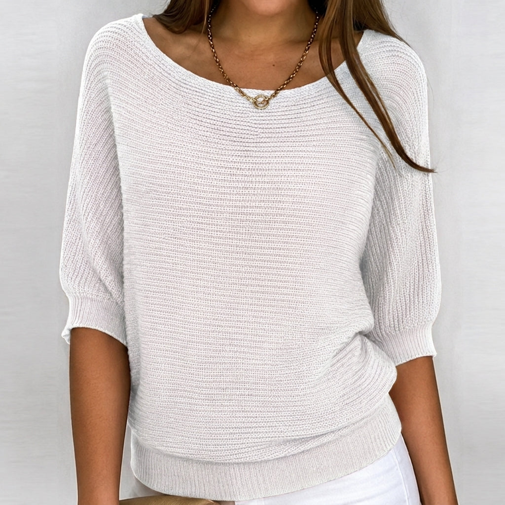 Effortless women's 3/4 sleeve knit top, a relaxed and versatile blouse for spring, fall, and everyday style.