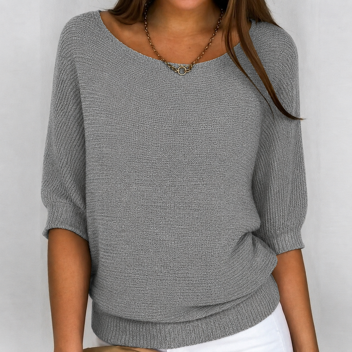 Women's relaxed fit 3/4 sleeve knit sweater, perfect for casual everyday wear in spring or fall.