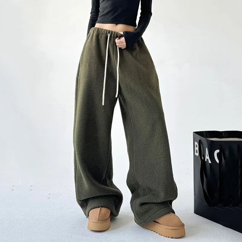 Relaxed fit unisex sweatpants, ultra-soft and cozy, with a convenient drawstring waist for ultimate comfort.