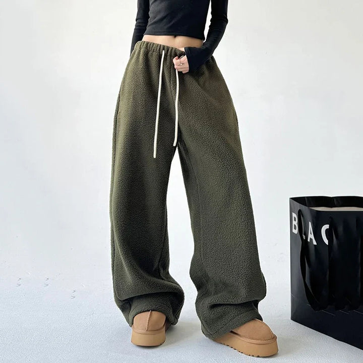 Relaxed fit unisex sweatpants, ultra-soft and cozy, with a convenient drawstring waist for ultimate comfort.