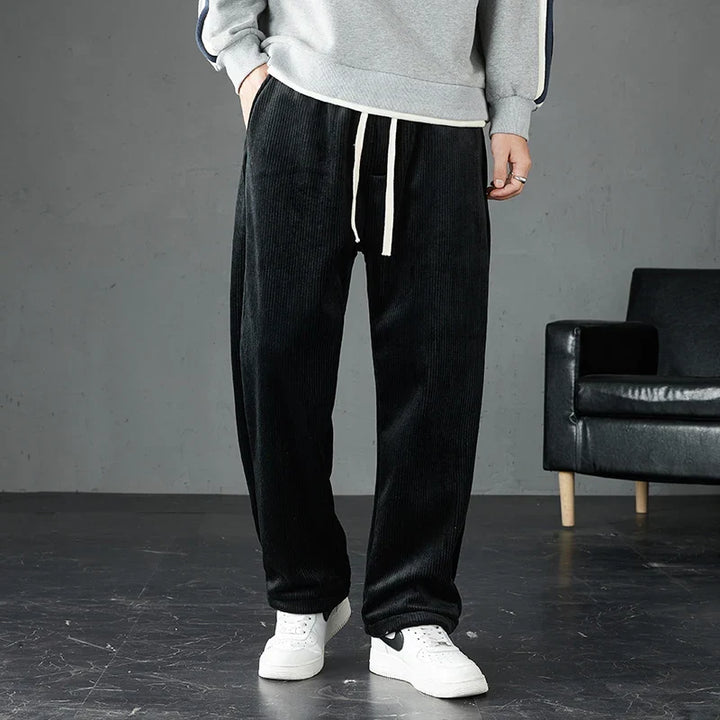 Soft corduroy men's joggers with an elastic waist, offering comfort and a relaxed straight leg fit.