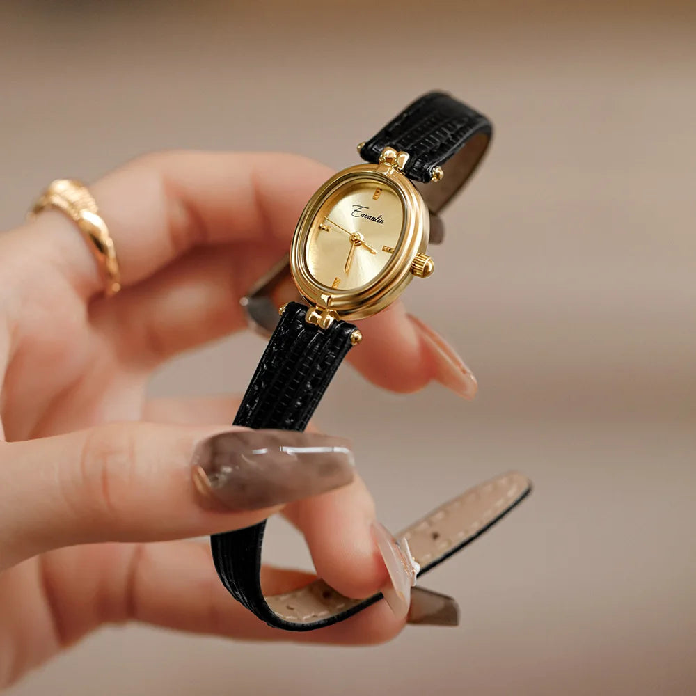 Brown women's elegant slim wristwatch with a sleek rectangle dial. Modern and sophisticated accessory.