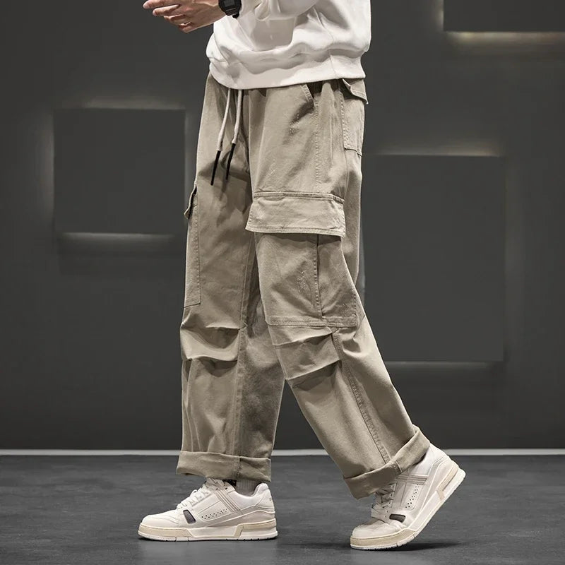 Khaki men's relaxed fit cargo pants, utility style with a drawstring waist for comfortable, everyday wear.