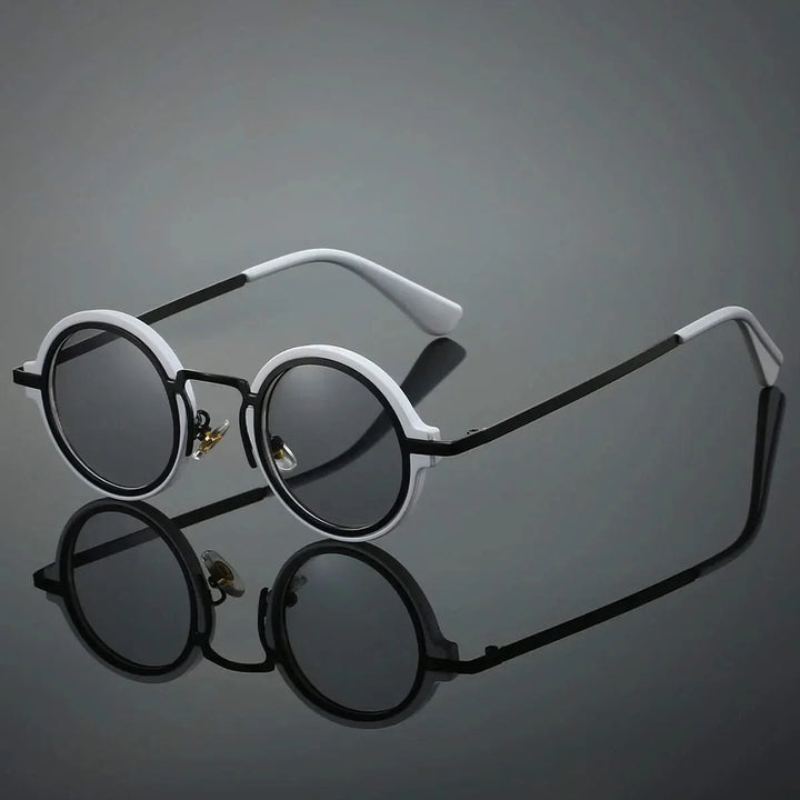 Black vintage round sunglasses, unisex fashion eyewear. Lightweight & glare-resistant shades for stylish sun protection.