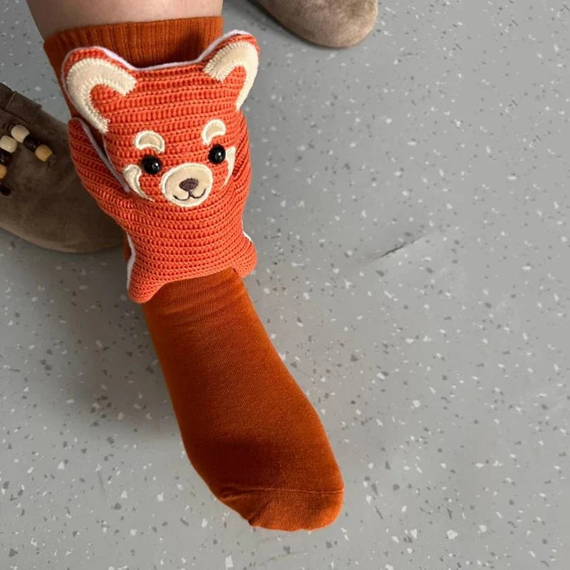 Warm house socks with non-slip sole, designed as cute animals for cozy, safe home wear.