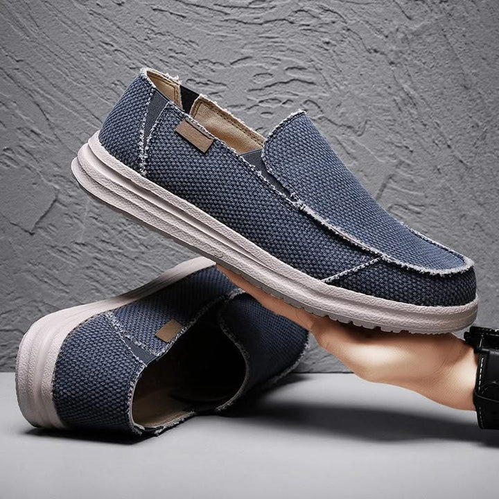 Classic men's slip-on mariner loafers in a durable design, offering flexible comfort and style.