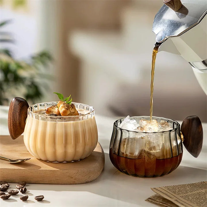 Clear borosilicate glass coffee mug with a modern design, ideal for hot or iced beverages.