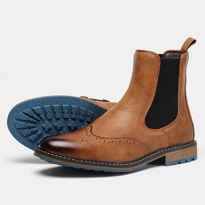 Men's modern Chelsea boots, designed for all-day comfort, with stretch panels and a stylish blue sole.