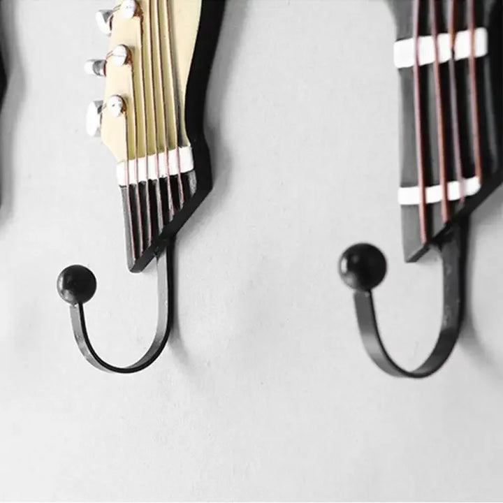 Stylish guitar wall hooks set for entryway storage. Organize keys, scarves, or hats with unique musical decor.