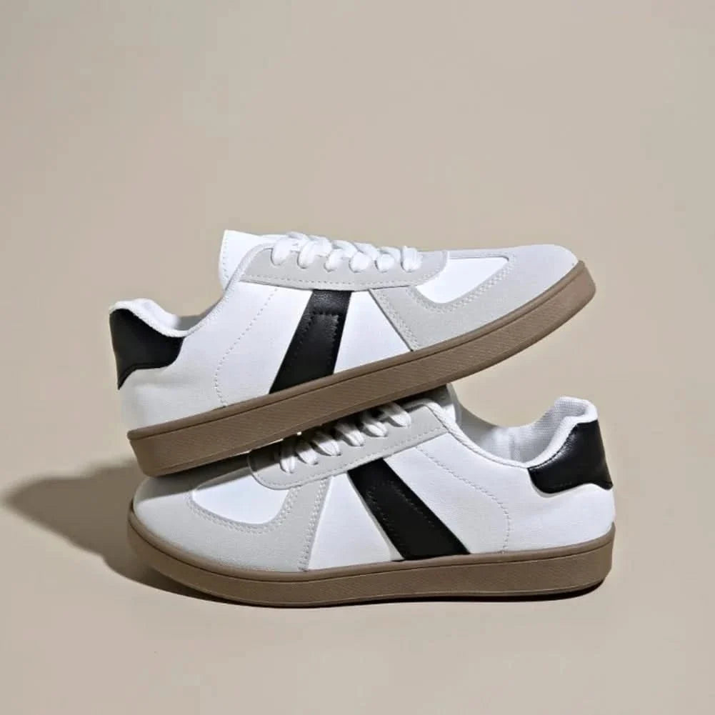 Sleek black women's casual sneakers, providing all-day comfort and a stylish look.