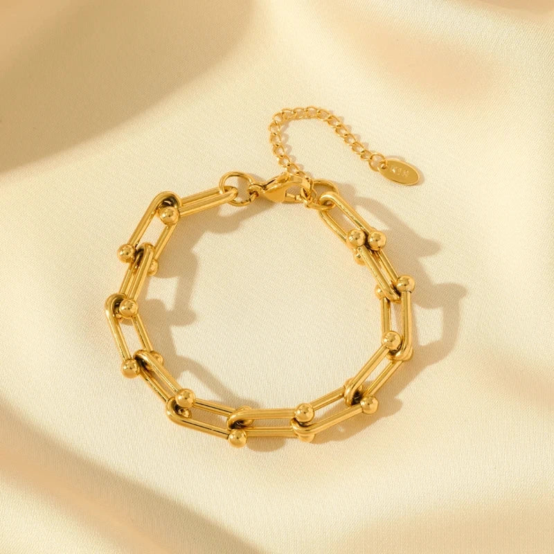 Stylish women's golden polished link chain necklace, perfect for any elegant outfit.