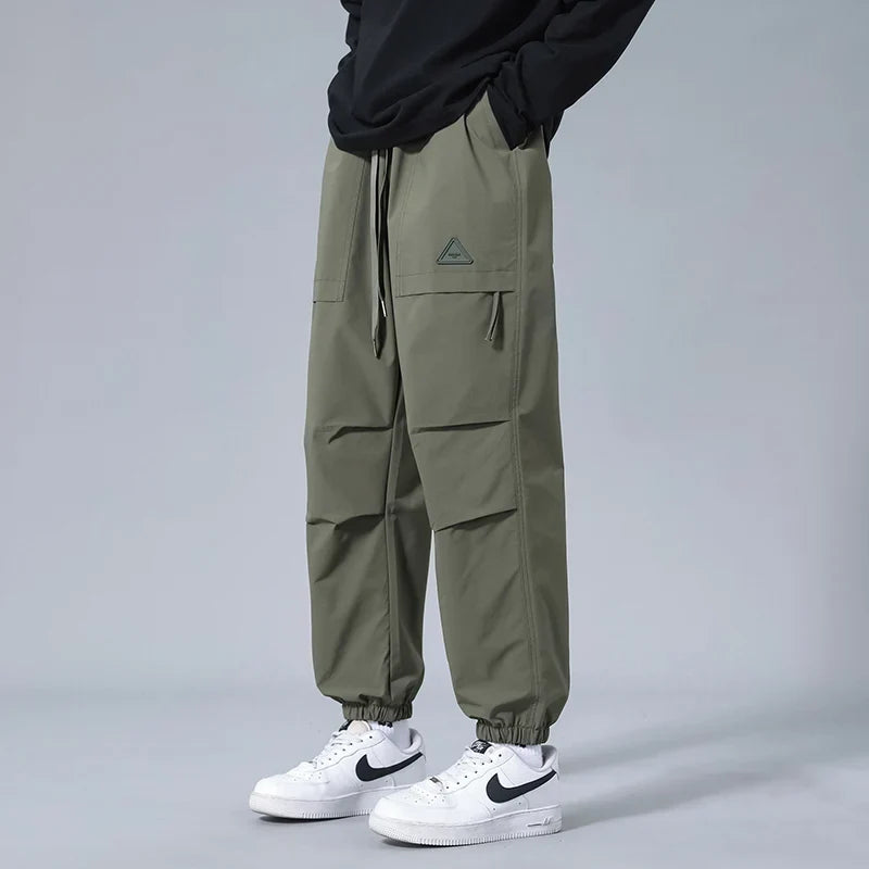 Stylish men's utility joggers with secure zipper pockets. Versatile for activewear, workouts, or daily casual fashion.