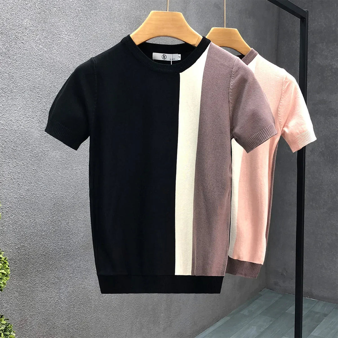 Modern men's color block crewneck sweater in black and pink. A versatile, stylish long sleeve top for casual outfits.