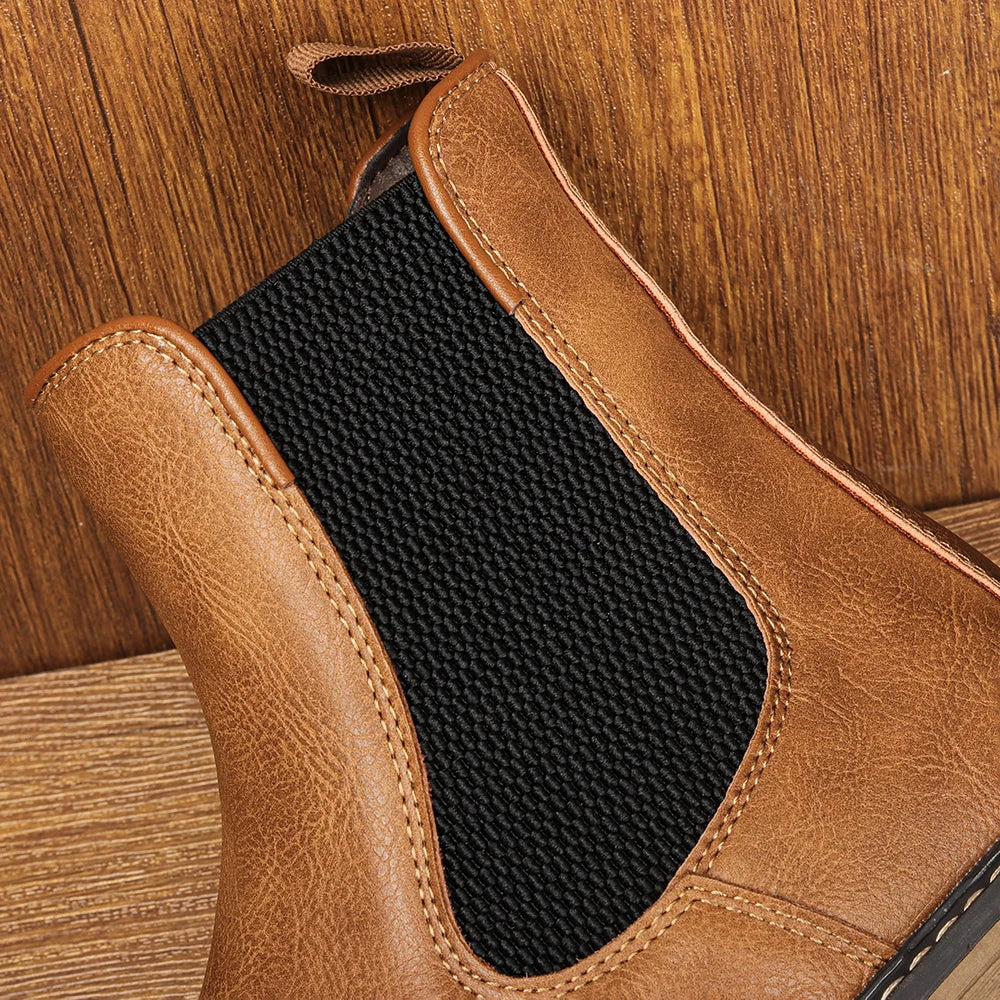 Fashionable men's winter boots; pull-on Chelsea design with superior comfort and a unique blue sole detail.