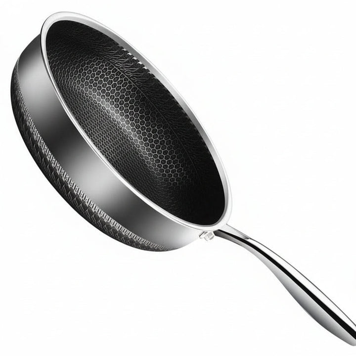 Versatile stainless steel frying pan, essential for even cooking and professional results; induction and oven safe.