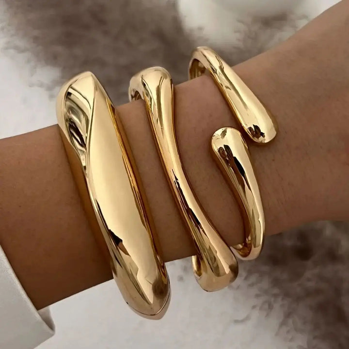 Elegant women's gold and silver stackable bracelets with vintage design, perfect for a chic fashion accessory set.