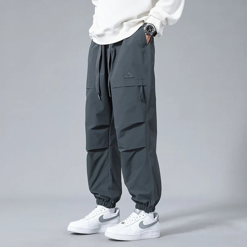 Men's utility joggers with secure zipper pockets. Ideal activewear & athletic pants for workouts & casual fashion.