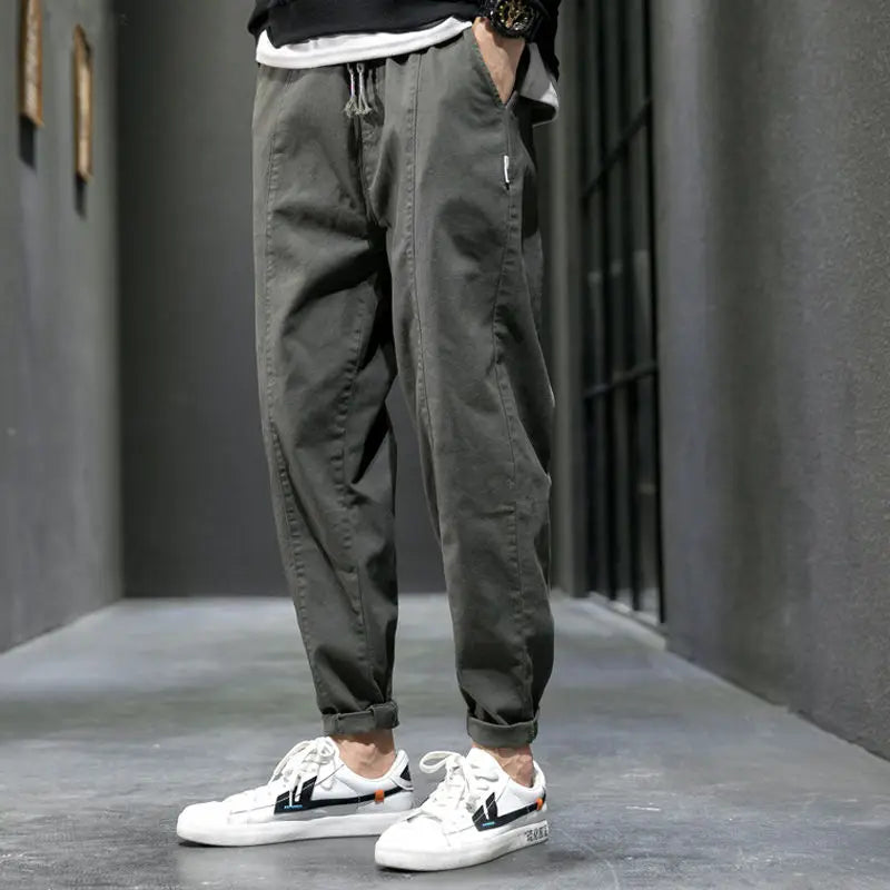 Army green men's tapered joggers, athletic fit & stylish for urban casual comfort.