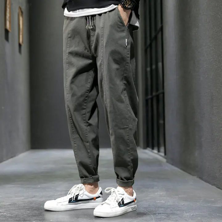 Army green men's tapered joggers, athletic fit & stylish for urban casual comfort.