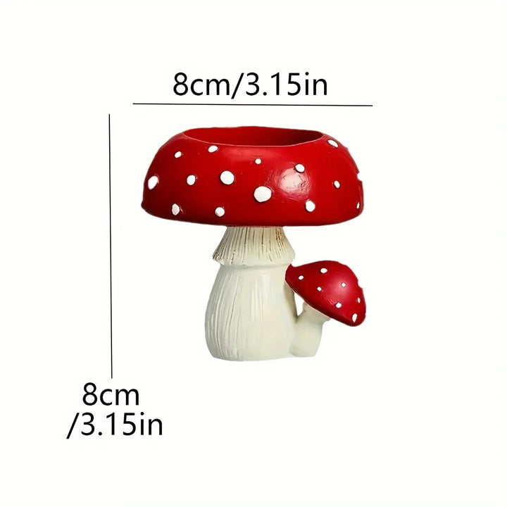 Charming whimsical mushroom candle stand, made of resin. Perfect decorative piece for cozy home decor.