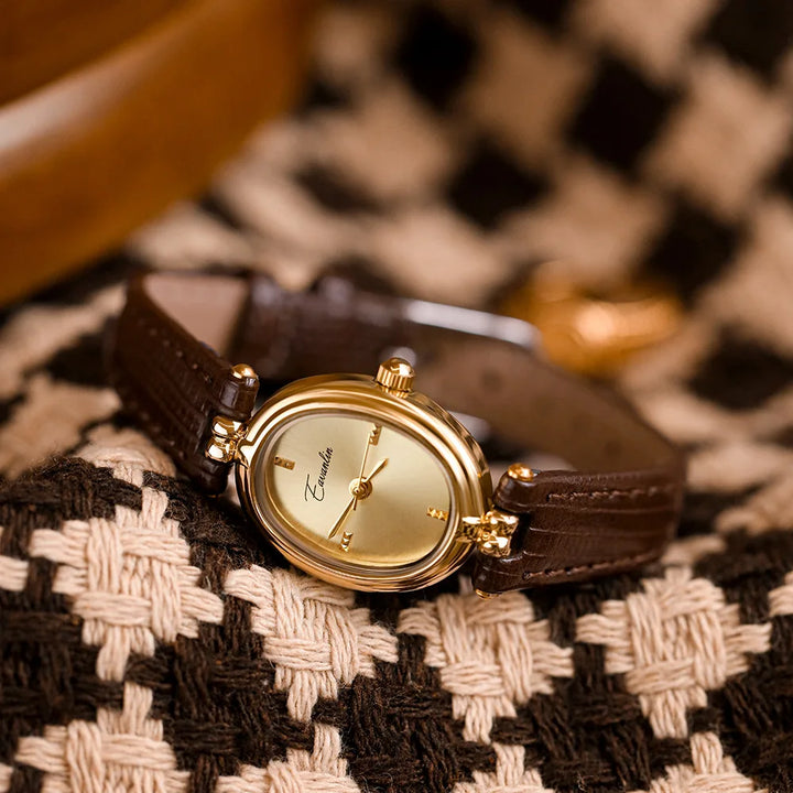 Close-up of an elegant slim women's wristwatch, highlighting its sophisticated and modern design.