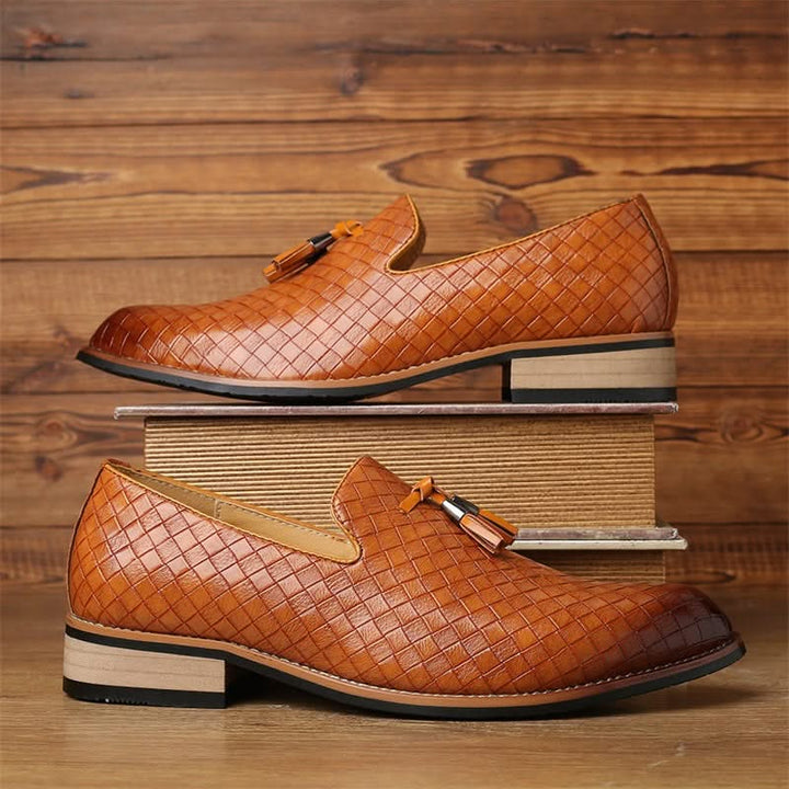 Front view of stylish men's woven loafers with twin tassels, ideal for dress or casual smart outfits.