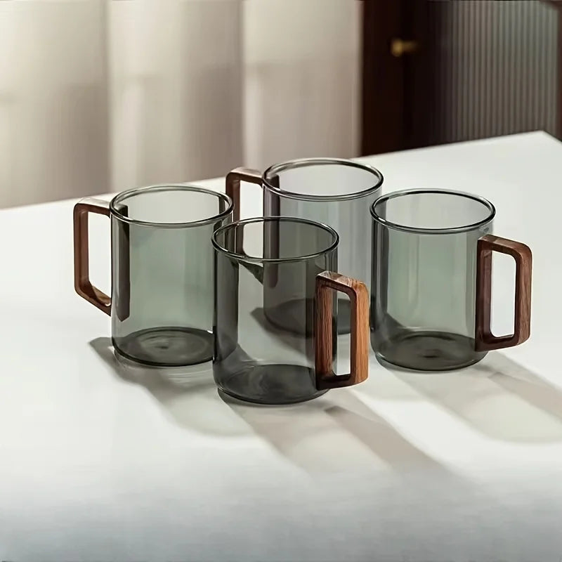 Premium borosilicate glass coffee mug with an elegant walnut wood handle for a comfortable grip.