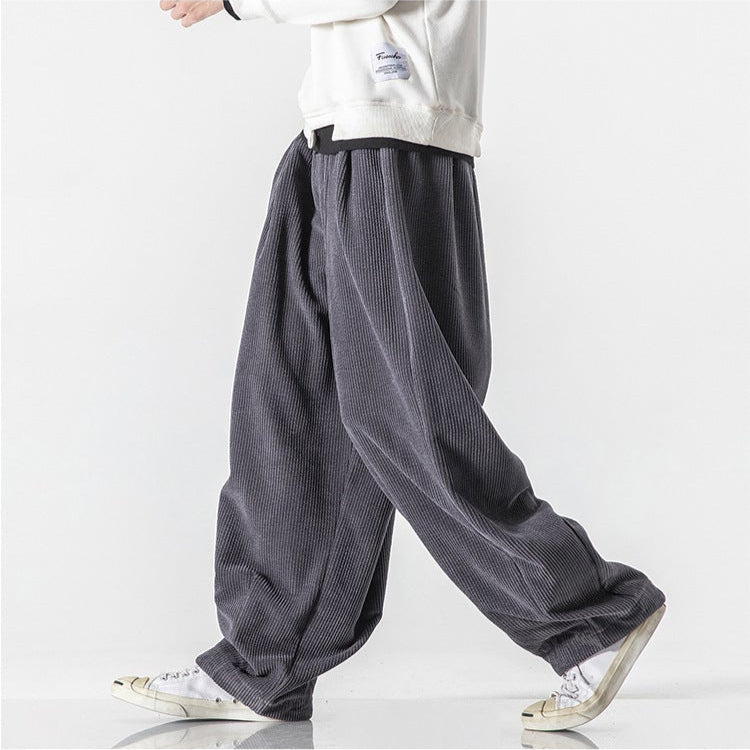 Unisex relaxed fit sweatpants featuring an elastic waist and adjustable drawstring for perfect comfort.