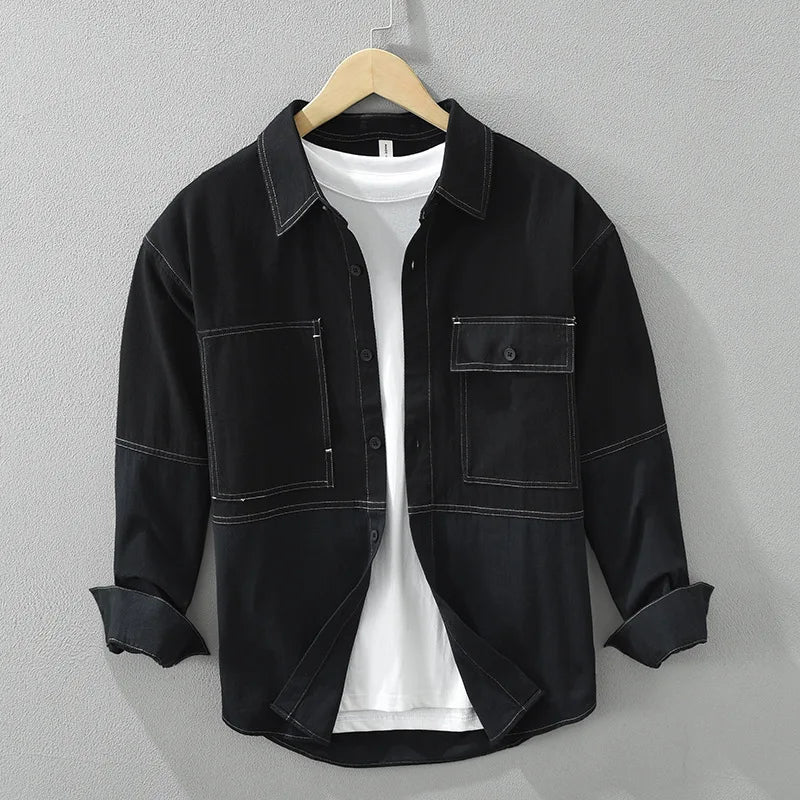 Stylish men's two-tone utility overshirt jacket, ideal for fall and spring layering. Modern menswear.