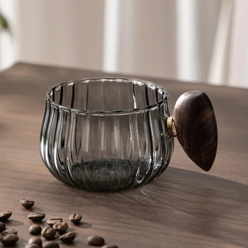 Modern borosilicate glass mug, a versatile piece of drinkware suitable for coffee, tea, or water.
